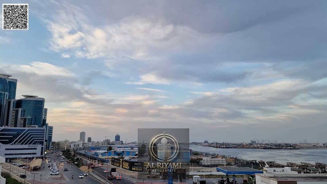 Two-bedroom apartment with a living room and a balcony offering a stunning open view of the port area.