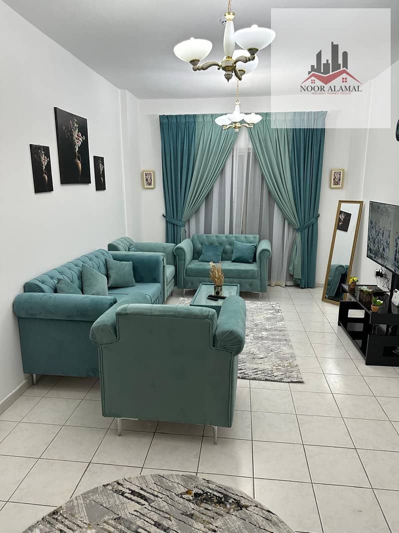 Sharjah, Al Taawun, near Oriana Hospital. Furnished apartment, super deluxe, two bedrooms, living room, kitchen, two bathrooms, and balcony.