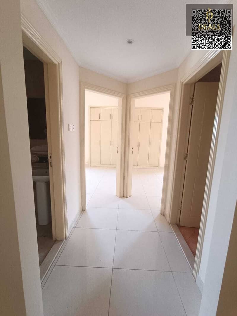 For rent Ajman Al Nuaimiya 1 2BR hall balcony gym pool central AC near Al Hikmah School AED 38K