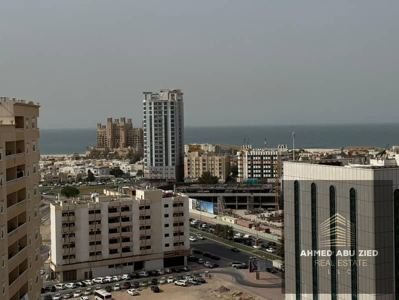 Luxury 2-bedroom, 2-living room apartment for rent in Al Naeemiyah 3 with sea view, spacious kitchen, 2 bathrooms, balcony, super deluxe finishes, fre