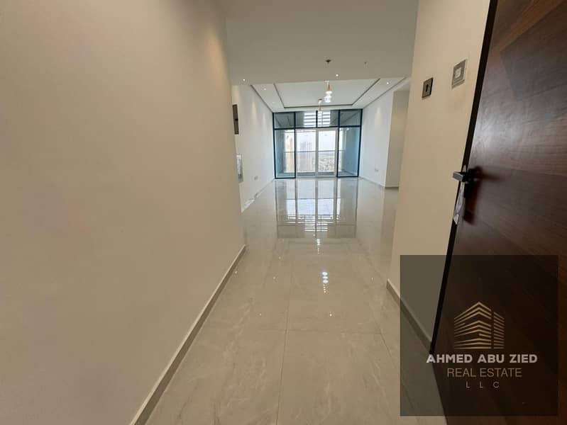 Luxury 2-bedroom apartment with maid room, spacious living room, 2 bathrooms, large kitchen, balcony with open view, super deluxe finishes, free parki