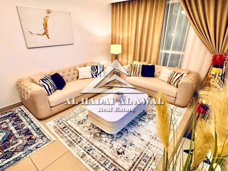 Sharjah, Al Khan Corniche: One bedroom and living room apartment with balcony and view, super deluxe furnishings. Rent 5000 AED with internet only.