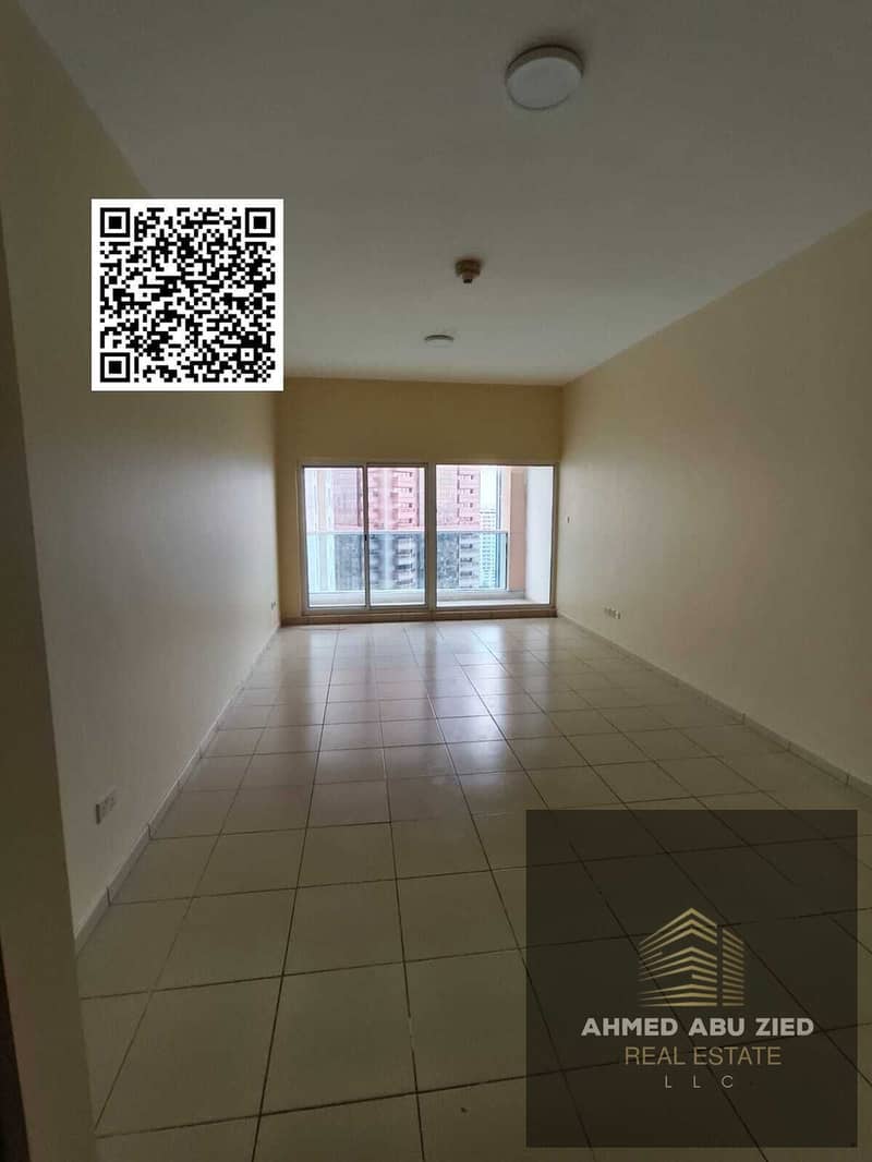 One bedroom and a living room in Ajman One Towers | Large balcony | Central air conditioning | Garden | Built-in wardrobes