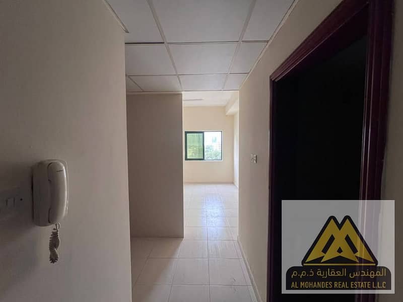 A fully equipped separate kitchen studio apartment with central air conditioning, located near the Dubai and Sharjah exit.