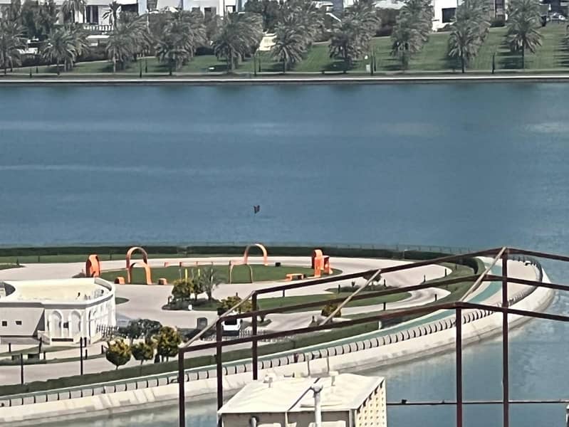 Sea view + free parking, two bedrooms and a living room with built-in wardrobes, large balcony, for annual rent in Al Khan, Sharjah