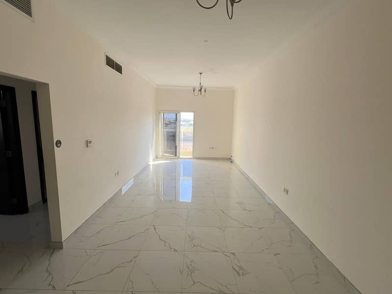 Two rooms and a hall for annual rent in Al Jarf 3 in Ajman - with free parking, a special location and close to the Chinese market and the tribal cent