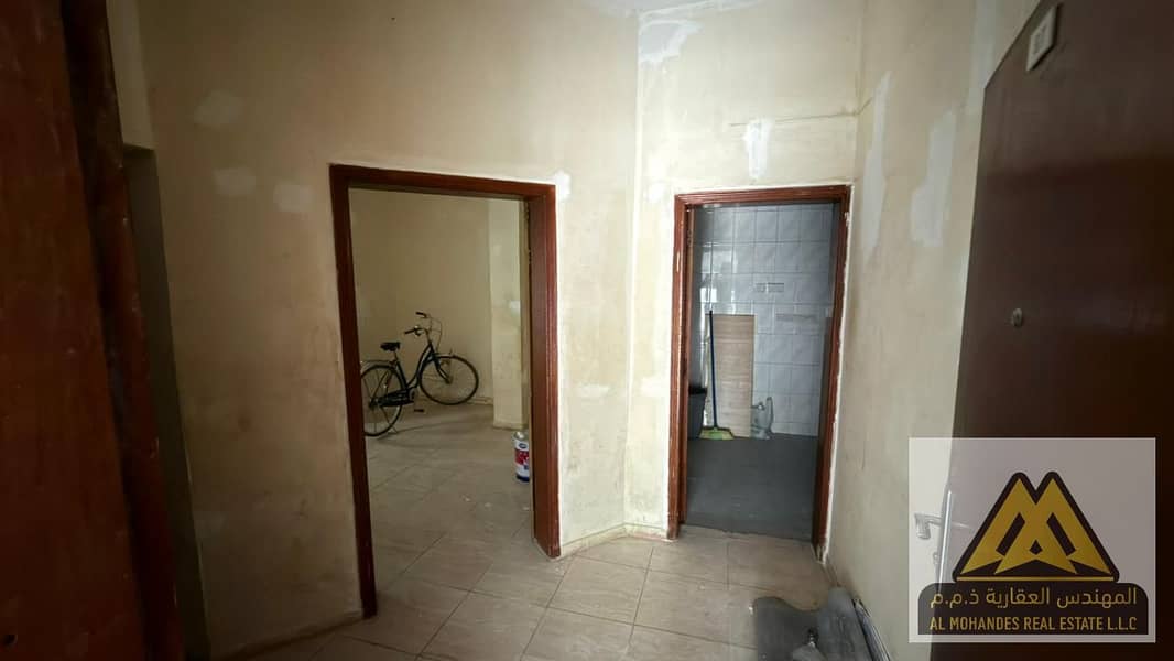 Studio apartment for annual rent in Al Nakheel 1, Ajman. Ground floor, split AC, prime location, second row from the Corniche.