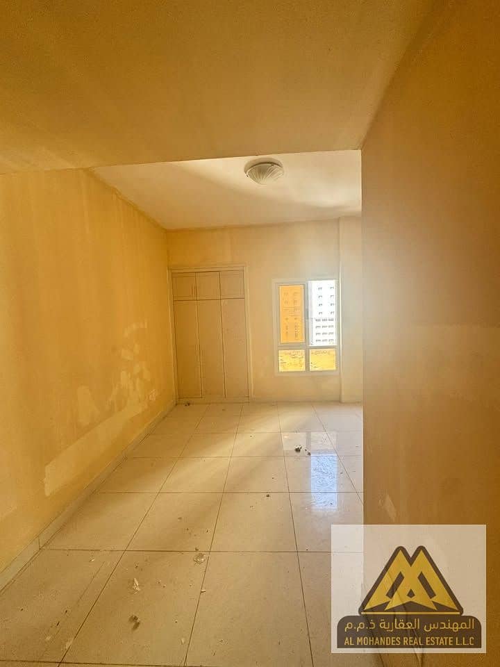 Spacious 1-bedroom apartment for rent in Al Nuaimiya 1, Ajman, 2 bathrooms, central AC, prime location near Al Hikma School, AED 29,000 yearly in 4 pa