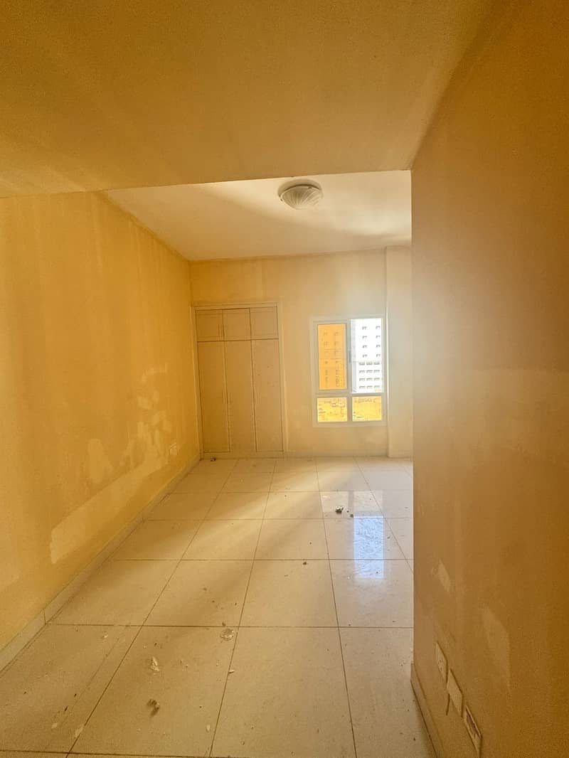 One bedroom and living room for annual rent in Al Nuaimiya 1, Ajman 30,000 AED in 4 installments 2 bathrooms, built-in wardrobes, spacious, master bed