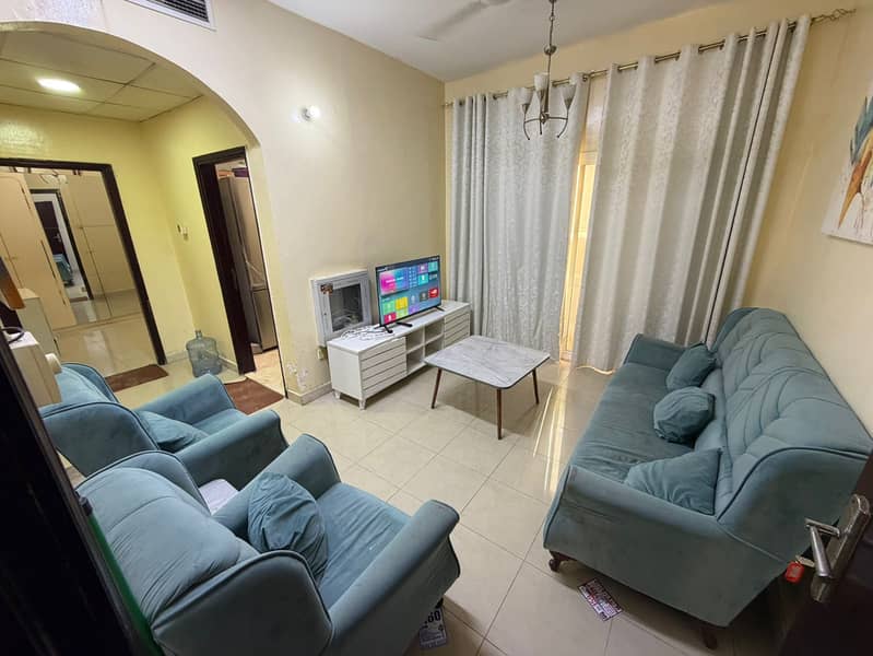 One bedroom and living room for monthly rent on Ajman Corniche, including bills but without internet, 3300 AED, with a balcony and excellent view.