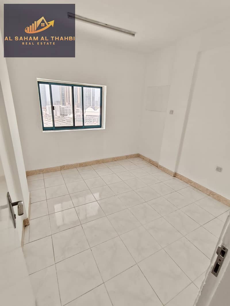 Two-bedroom apartment with a living room and balcony for rent in Al Taawun