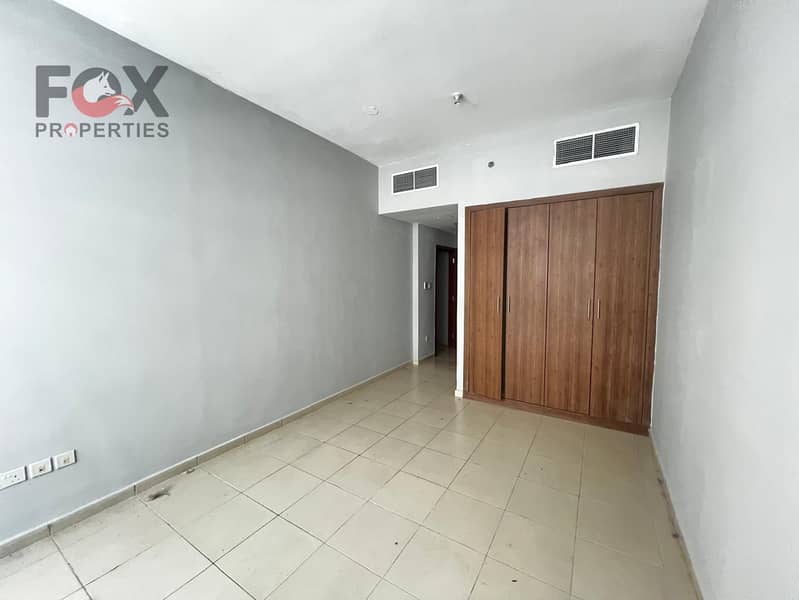 Two rooms and a living room with a pool and gym for annual rent in Al Rashidiya 3