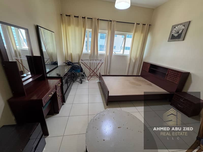 Fully furnished studio apartment for annual rent in Ajman One Towers, Al Rashidiya 3. Very spacious, free parking, swimming pool and garden, central a