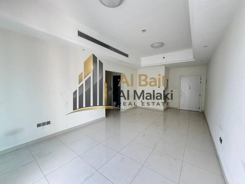 Spacious 2-bedroom master apartment in Al Qasba with free central AC, parking, gym, and pool for AED 69,000 annually.