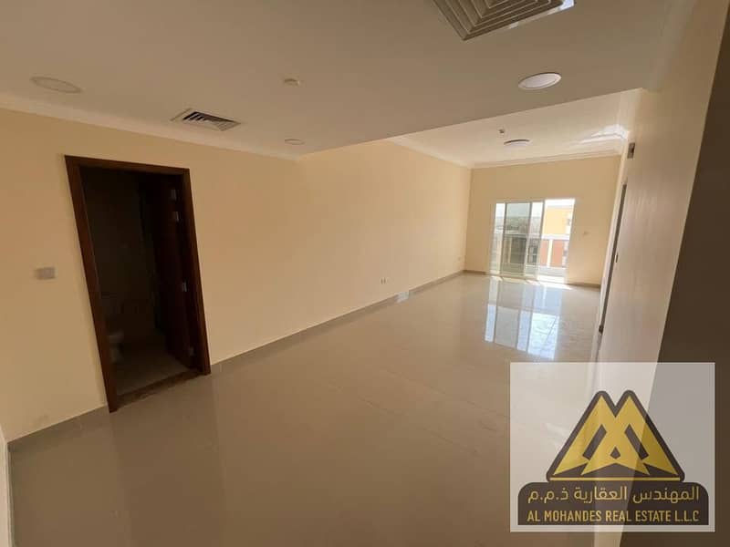 1-bedroom apartment with living room for rent in Al Jurf 3, Ajman, first tenant, master room, 2 bathrooms, balcony with open view, central AC, wardrob