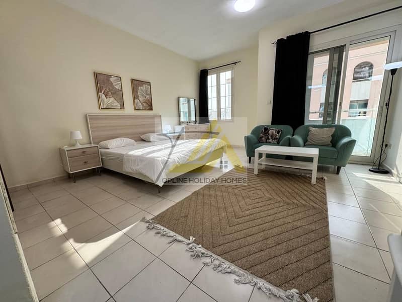 Spacious Studio with Balcony | England Cluster | International City | Ready to Move