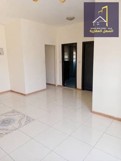 1 Slaapkamer Appartement te Huur in Al Qulayaah, Sharjah - Minimalist hallway with tiled floor (1). png