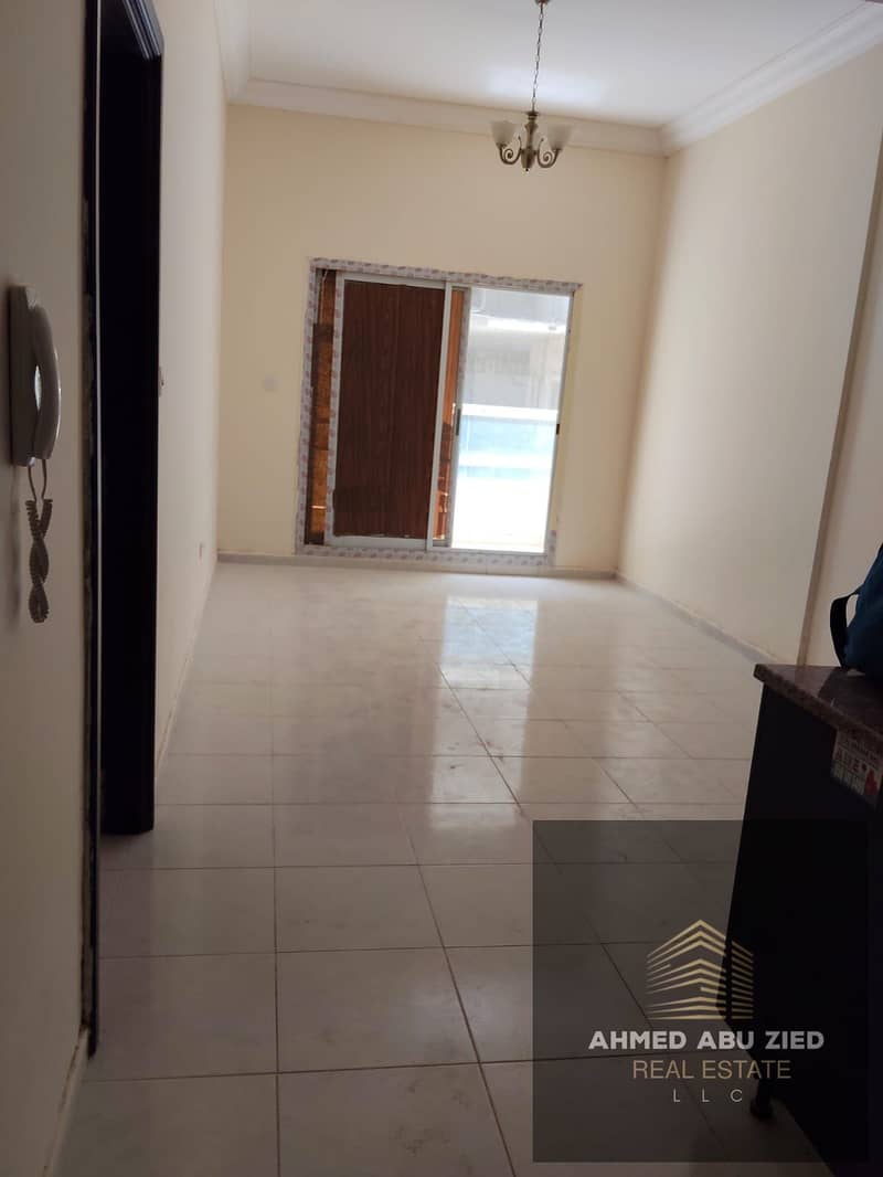 One bedroom with living room for rent in Emirates City Ajman, master room, maid room, balcony, central AC, American kitchen, Sheikh Mohammed Bin Zayed