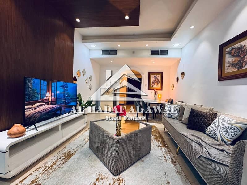 Two bedrooms and a living room in Al Khan with a balcony and three bathrooms. Rent 5000, deposit 1000.