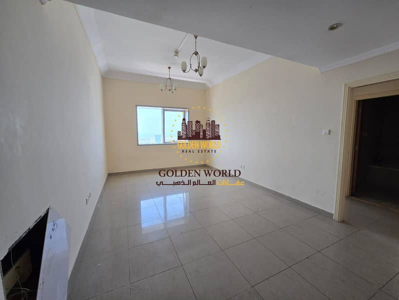 1BR apartment in Al Qasimia, Sharjah. Master room, large kitchen, built-ins, open sea view, 2 baths. Prime area, easy Dubai access. AED 33K yearly.