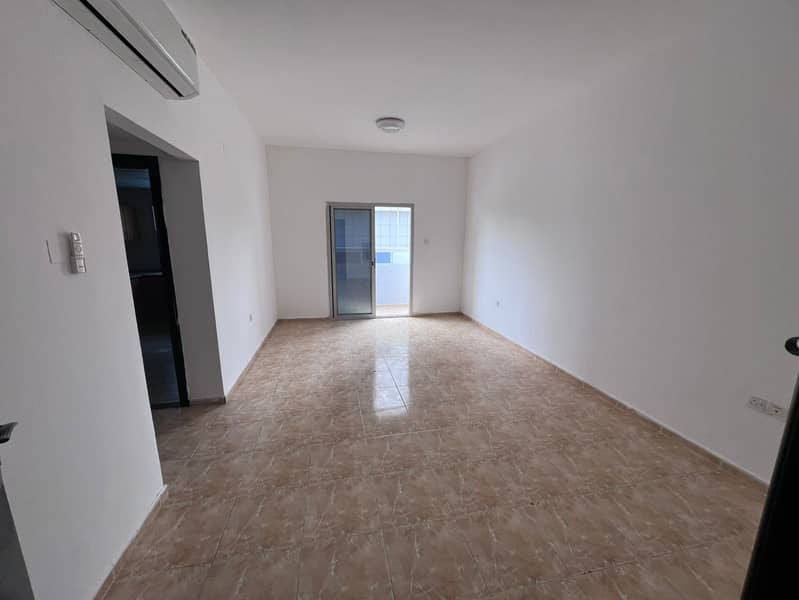 Two rooms and a living room for annual rent Rashediya 2 Ajman, a lively location and close to all services