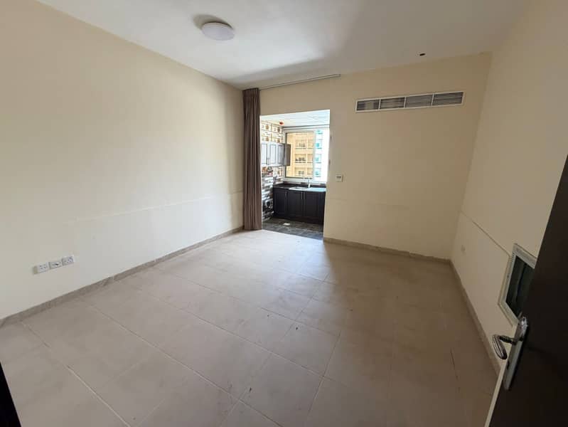 Studio apartment in Al Rashidiya 3, Ajman, with central air conditioning, suitable for families, and a separate kitchen.