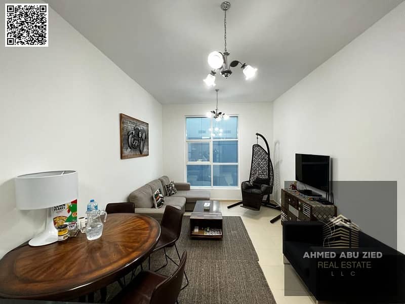 Furnished one-bedroom apartment with a balcony for annual rent in Al Nuaimiya 3 - City Towers | Prime location, spacious layout with private parking,