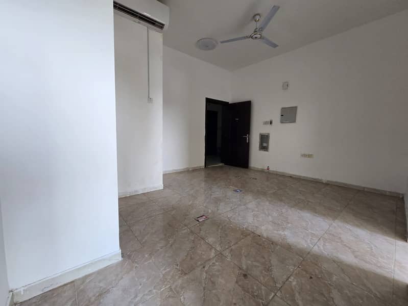 Two-bedroom apartment with a living room for annual rent - Al Rawda 3, Ajman - Balcony with a distinctive open view - Free maintenance