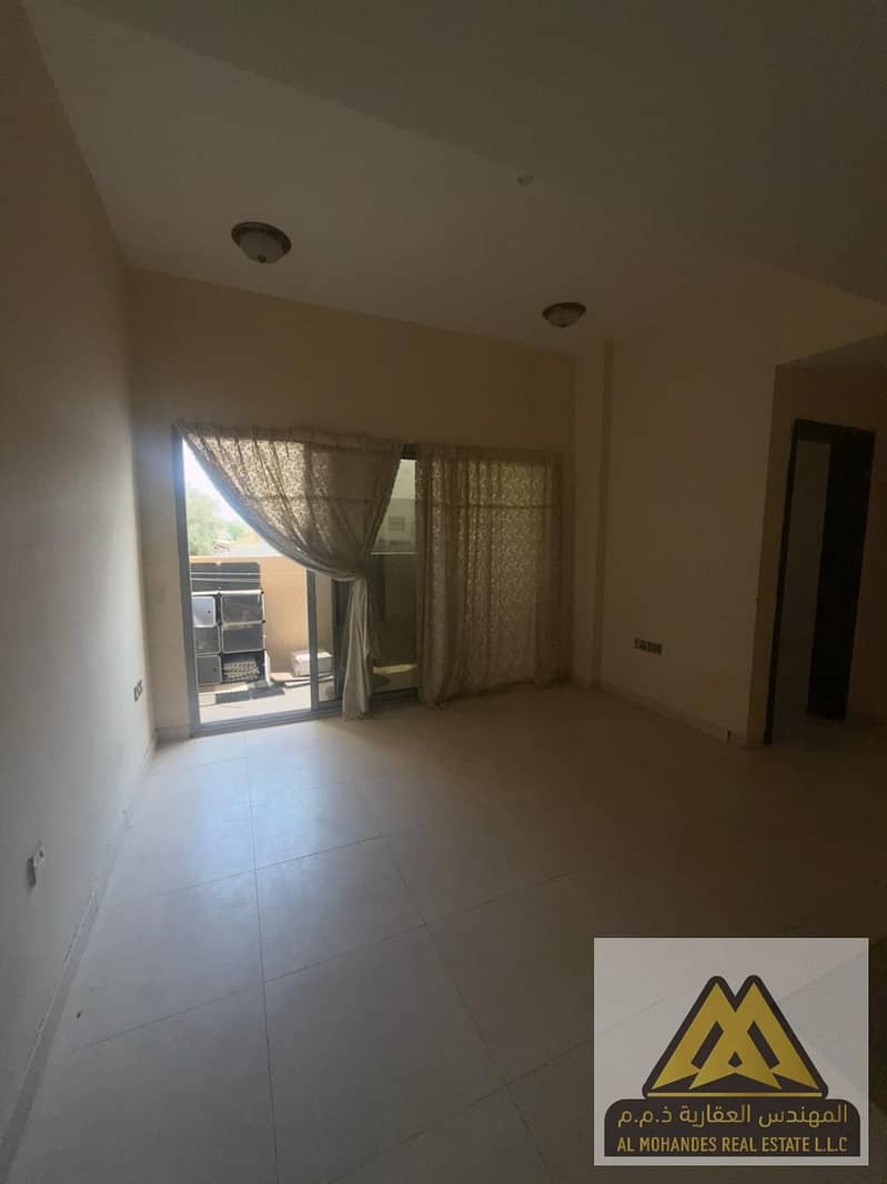 Two-bedroom apartment with a living room and balcony for annual rent – Al Rawda 1, Ajman. Spacious, affordable, and conveniently located.