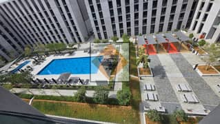 شقة مفروشة بالكامل للبيع في طراز الجادة | إطلالة مسبح | جاهزة للسكن