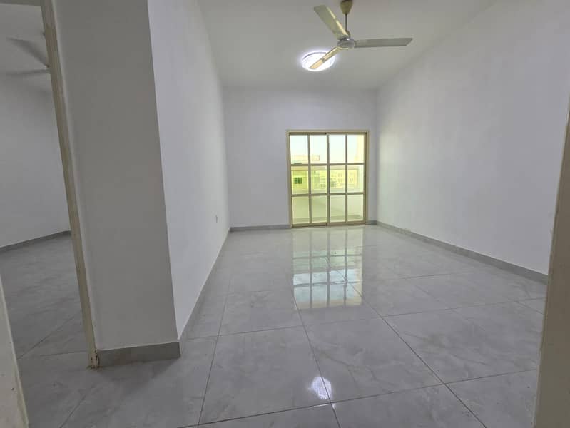 One bedroom and living room for annual rent in Al Rawda 2, Ajman. Balcony, open view, central air conditioning, prime location with 24/7 service