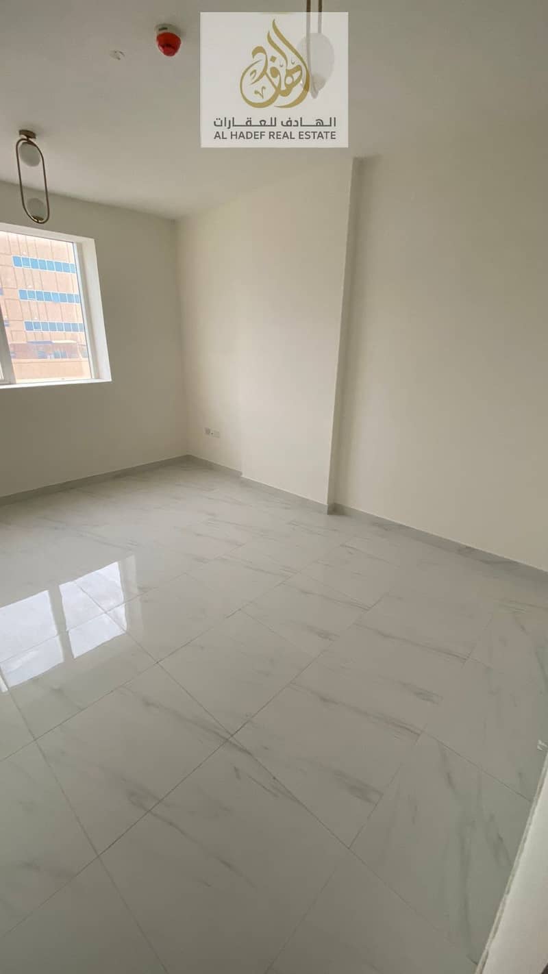 A spacious apartment is available for annual rent in Al Jurf 3, Ajman, located in a prime area close to the China Mall, offering easy access to all es