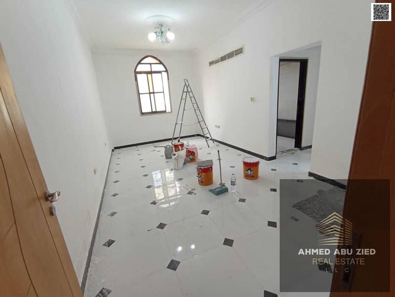 Elegant luxury apartment with two bedrooms large living room balcony open view central AC free maintenance throughout lease in lively area near servic