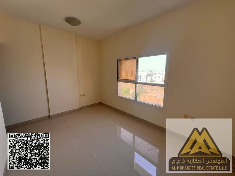 Studio for annual rent in Al Nuaimiya 3 Ajman, separate kitchen, central AC, good space, near Sharjah & MBZ Road. AED 22K yearly, 4 payments.
