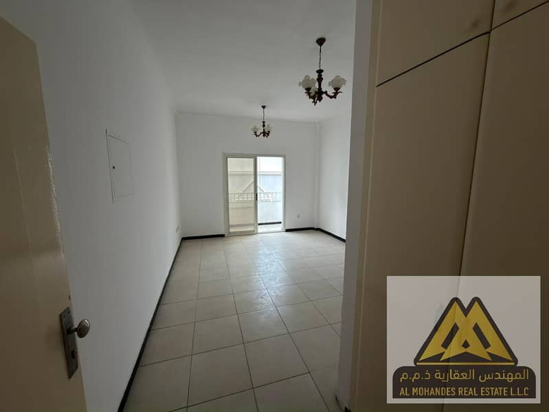 Al Nuaimiya 2, Ajman, featuring a practical layout, balcony, and built-in wardrobes, located directly on Al King Faisal Street and close to all essen