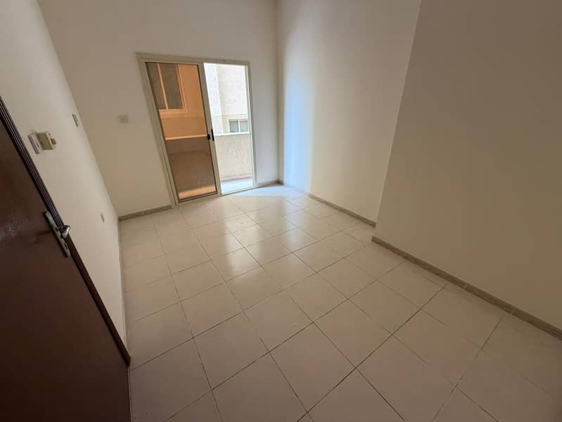 One-bedroom apartment for annual rent, second occupant, with central air conditioning, balcony, and bathroom in Al Hamidiya. Prime location