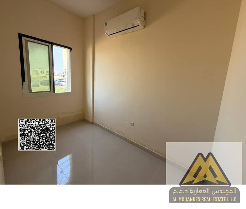 Studio in Al Alia, Ajman. Separate kitchen, prime location near Mohammed Bin Zayed Road and services. Rent AED 20,000 yearly, 4 payments. Comfortable