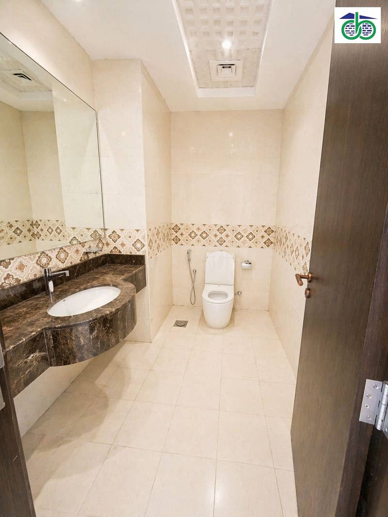 5 Modern beige bathroom with marble accents. png