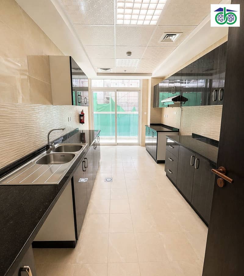 3 Modern galley kitchen with bright view. png