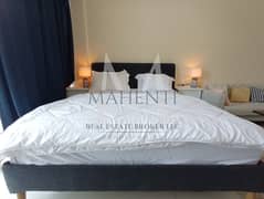 استوديو مفروش | برج أواسيس 1 | إطلالة على المجتمع والقناة