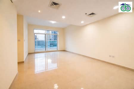 2 Bedroom Apartment for Rent in Al Furjan, Dubai - Spacious living room with city view. png