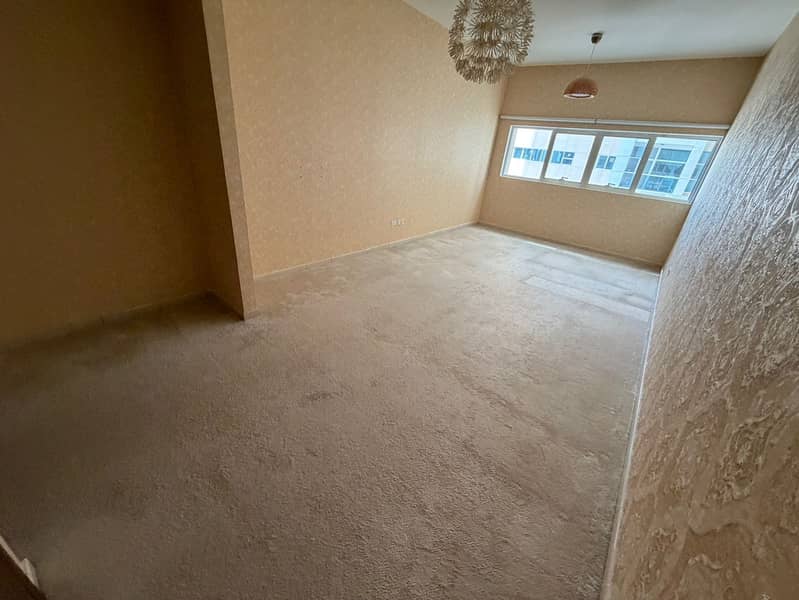 The most beautiful studios for annual rent in the most beautiful towers in Ajman, with built-in wardrobes, central air conditioning and cooling system