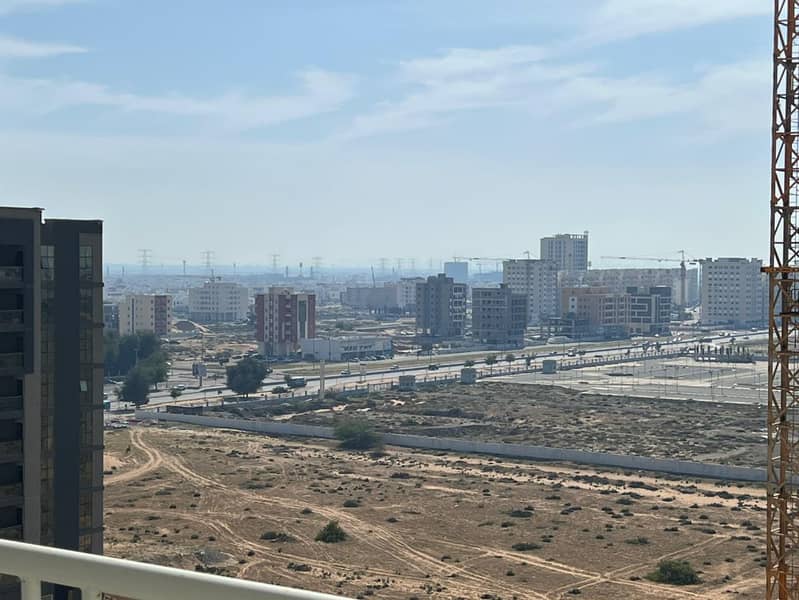 Two-bedroom apartment with a living room - Al Amrah, Ajman - Central air conditioning - Family accommodation - Free maintenance