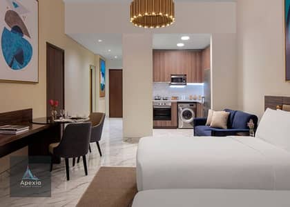 شقة فندقية  للايجار في مدينة دبي للإعلام، دبي - VPVD_Avani-Studio_Living-Area. jpg