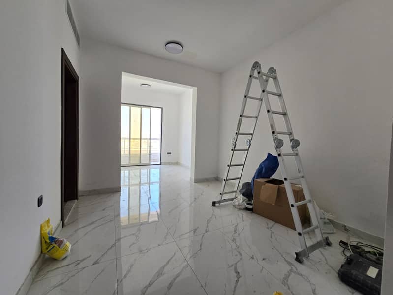 Brand new studio apartment, first occupancy, with modern finishes and a prime location near the academy and on the Sheikh Mohammed Bin Zayed Road exit