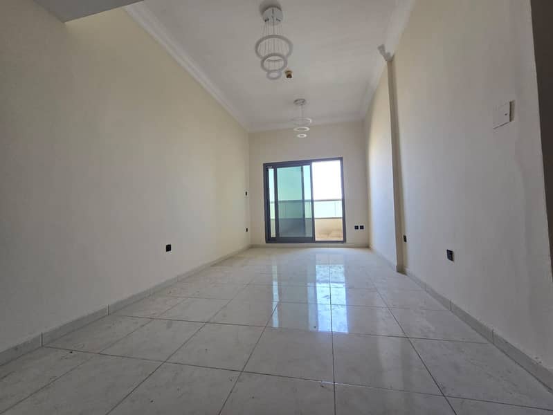 Emirates City, on Mohammed Bin Zayed Exit: One-bedroom apartment for annual rent. Features include: 1 bathroom, open-plan American kitchen,central air