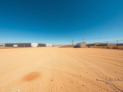 Industrial Land in Vendita a Al Jurf, Ajman - A_very_large_empty_industrial_yard_warehouse_lot_big_open_space_ground_level_wide_angle_photo_style. _Photorealistic_35mm_ultra_wide_composition_with_lots_of_negative_space_dusty_beige_gravel_dirt_surface_with_scatter. jpeg Industrial Land in Vendita a Al Jurf, Ajman - A_very_large_empty_industrial_yard_warehouse_lot_big_open_space_ground_level_wide_angle_photo_style. _Photorealistic_35mm_ultra_wide_composition_with_lots_of_negative_space_dusty_beige_gravel_dirt_surface_with_scatter. jpeg