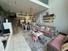 A Two-Bedroom Type A Loft with a backyard and front car parking