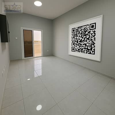 2 Schlafzimmer Wohnung zum zur Miete in Al Jurf, Ajman - Empty Modern Room with Framed QR Code. png