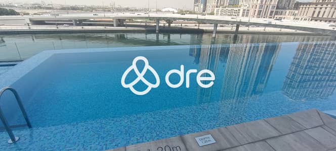 1 Bedroom Flat for Rent in Business Bay, Dubai - pool 2. jpg